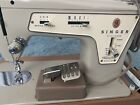 Vintage Singer sewing machine model 237 with foot pedal and case
