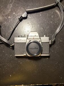 New ListingMinolta SRT SC-II camera With 2 Lenses, Filters, Flash, And Camera Bag