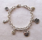 Cat Charm Bracelet has Hearts, Paw, Faces, Sitting Kitty, Silver, Lobster Clasp