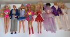 Lot of 8 Barbies And Ken With Outfits
