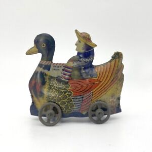 1900s Made in Japan RARE Penny Toy Dutch Person Riding on Duck Tin Toy