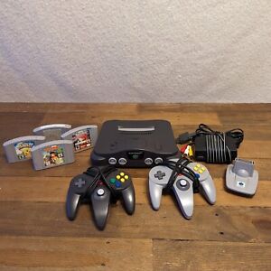 New ListingTESTED Nintendo 64 Console Lot w/ 4 Games 2 Controllers Transfer Pak POKEMON N64