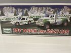 hess 2011 toy truck and race car with bag