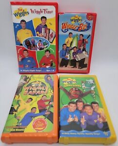 Lot of 4 The Wiggles Clamshell VHS Tapes Wiggly Safari, Yummy, Wiggle Bay & Time