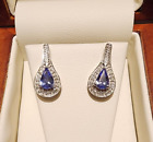 14k white gold pear shaped tanzanite and diamond earrings for pierced ears