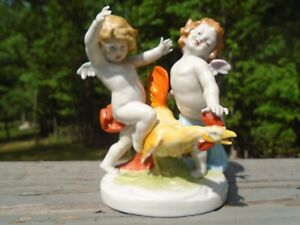 New ListingAntique Porcelain Figurine Cherub Putti w/ Rooster