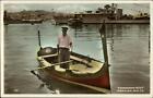 Malta Native Man Boat Dghajsa & Battleship #021 Tinted Real Photo Postcard