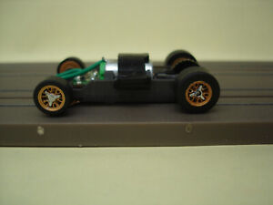 AFX RACING H.O. SCALE MEGA G+ 1.5 WIDE CHASSIS GOLD RIMS PAINTED CHROME SPINNERS