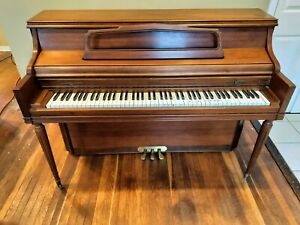 Beautiful Walnut Kimball upright piano, excellent condition.