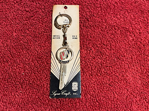 New ListingNOS BUICK CREST LOGO KEY BLANK WITH CHAIN RING 1950-1965 GOLD TONE