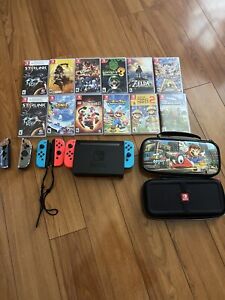 Nintendo Switch, 12 Games, 2 Nintendo Cases, And 2 More Controller READ DISC!!!!