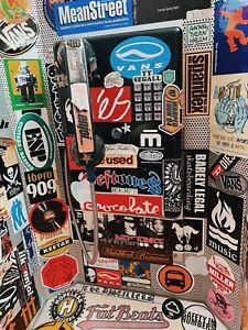 Functional Vintage Street Telephone Booth Covered in Music Stickers
