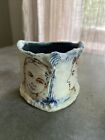 New ListingVintage Hand Crafted Art Pottery Vase Sketch Style Faces Signed Laurie Shaman