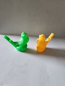 2 Vintage 1 Yellow and 1 Green Hard Plastic Bird Singing Water Whistle