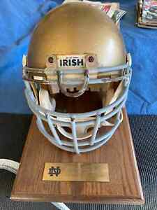 NOTRE DAME GAME WORN FOOTBALL HELMET ON WOOD BASE W/ CERTIFICATE OF AUTHENTICITY