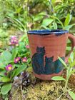 Vintage Handmade art pottery mug with two teal cats and flowers signed Reese