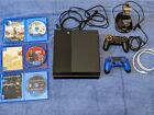 Playstation PS4 console with 3 games and charging stand