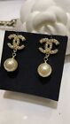 Chanel Ear stud Gold Pearl Starburst CC Pearl pendant earrings