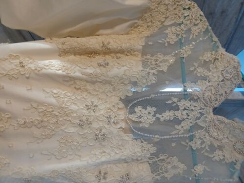 Beautiful Ivory wedding gown Size 10, preserved in wedding chest and veil.