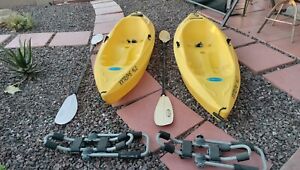  2 ocean kayaks, sit on top, 8 feet, paddles included.
