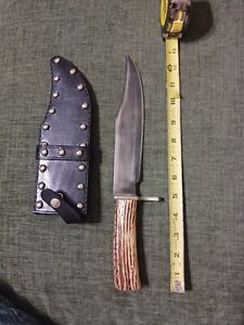 Used large bowie knife. 8 In Blade. Stag Handle. Leather Studded Sheath. Sharp!!