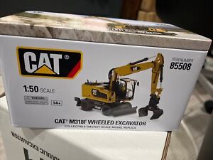 CAT M318F Wheeled Excavator w/ Operator 1:50 Model - Diecast Masters 85508