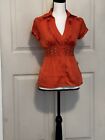 Bebe: Orange-Embellished Button Up Silk Blouse. Preowned -Excellent Condition.