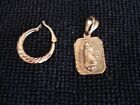 22 K Solid Gold Pendant weighs 2 grams. 14 K earring sells with pendant