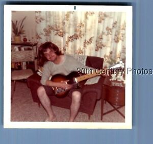 FOUND COLOR PHOTO O+9059 MA SITTING IN CHAIR PLAYING GUITAR