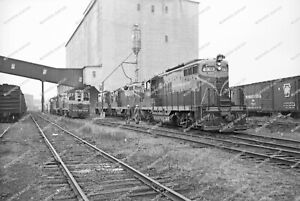 27.	ORIG NEG Grand Trunk 4903 GP9 with other GP9s and CV SW12100s Original 35 MM
