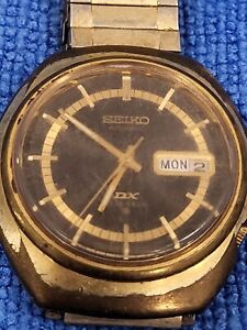 VINTAGE MENS SEIKO DX AUTOMATIC REFERENCE 6106-8579 BLACK AND GOLD DIAL RUNNING