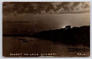 Milford Iowa~Sunset Thru Trees On Lake Okoboji~Rowboats~Dock~c1920s RPPC