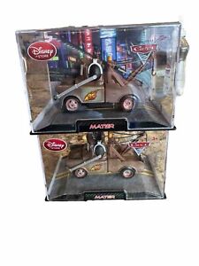 Disney Store Cars 2 Movie Mater Headset 1:43 Toy Car w/ Acrylic Case.  Lot Of 2
