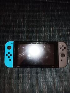 Nintendo Switch Console with blue and gray Joycons. FOR PARTS NOT WORKING