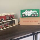 hess toy trucks Lot Of Two. 1986 Fire Truck Bank NIB, 2019 Tow Truck NIB