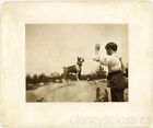 1910 Man Holds Up Treat for Boston Terrier Dog on Rock Cabinet Photo