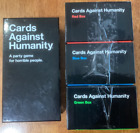 Cards Against Humanity Set of 4 Boxes including Red, Geen, and Blue (open box)