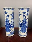 A pair of 19th century blue and white figure vases.