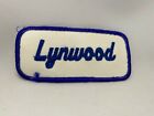 LYNWOOD  USED EMBROIDERED  SEW ON NAME PATCH TAGS BLUE ON WHITE