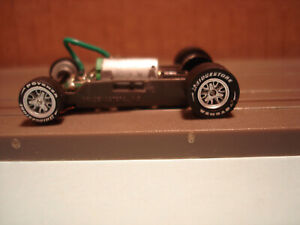 AFX RACING H.O. SCALE MEGA G+ 1.5 NARROW CHASSIS SILVER SPINNER RIMS & LETT TIRE