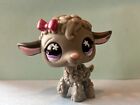 Littlest pet shop lamb with grey wool, purple eyes, and a pink bow