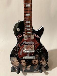 Rolling Stones  10” Tribute Guitar With Stand. Reproduction Autographs.