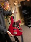 Candy Apple Red Fender Jazz Bass Guitar Deluxe Series with Tortoise pic- board