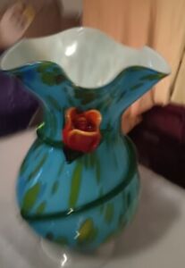large hand blown vase with applied roses