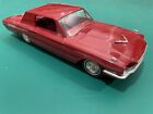 Up for auction is a red 1966 Ford Thunderbird promo car.