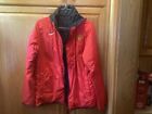 A Nike Large Manchester United Reversible Red And Black Jacket With A Small Tear