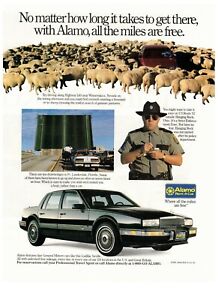1991 Alamo Rent a Car Sheep Herd Black Sedan Vintage Print Advertisement