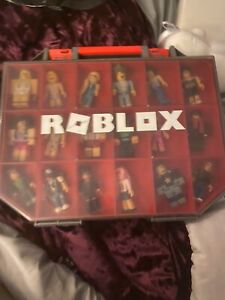 26 roblox toys, with accessories, case, and furniture. Slightly used