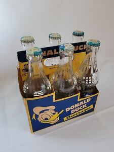 Rare Disney Donald Duck Beverages Six Pack Soda Bottle and Caps with Carrier