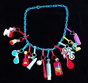 1980’s VINTAGE BELL CLIP CHARM NECKLACE WITH 12  PLASTIC CHARMS